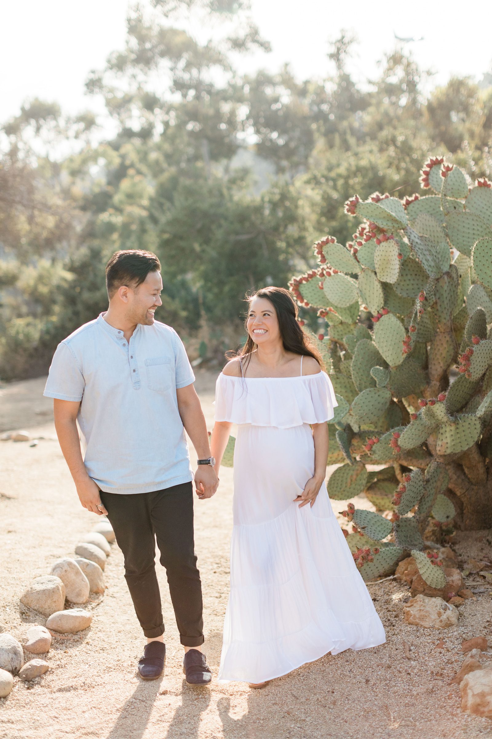 cactus garden maternity session with expecting couple